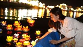 Solo Traveler doing Lantern Release from Boat